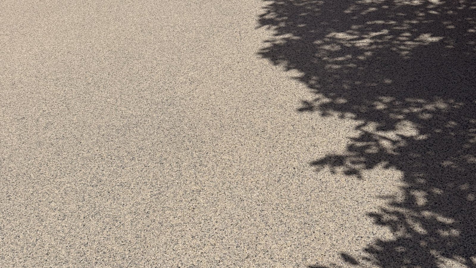 Close-up of Honey Gold resin bound aggregate on a completed driveway