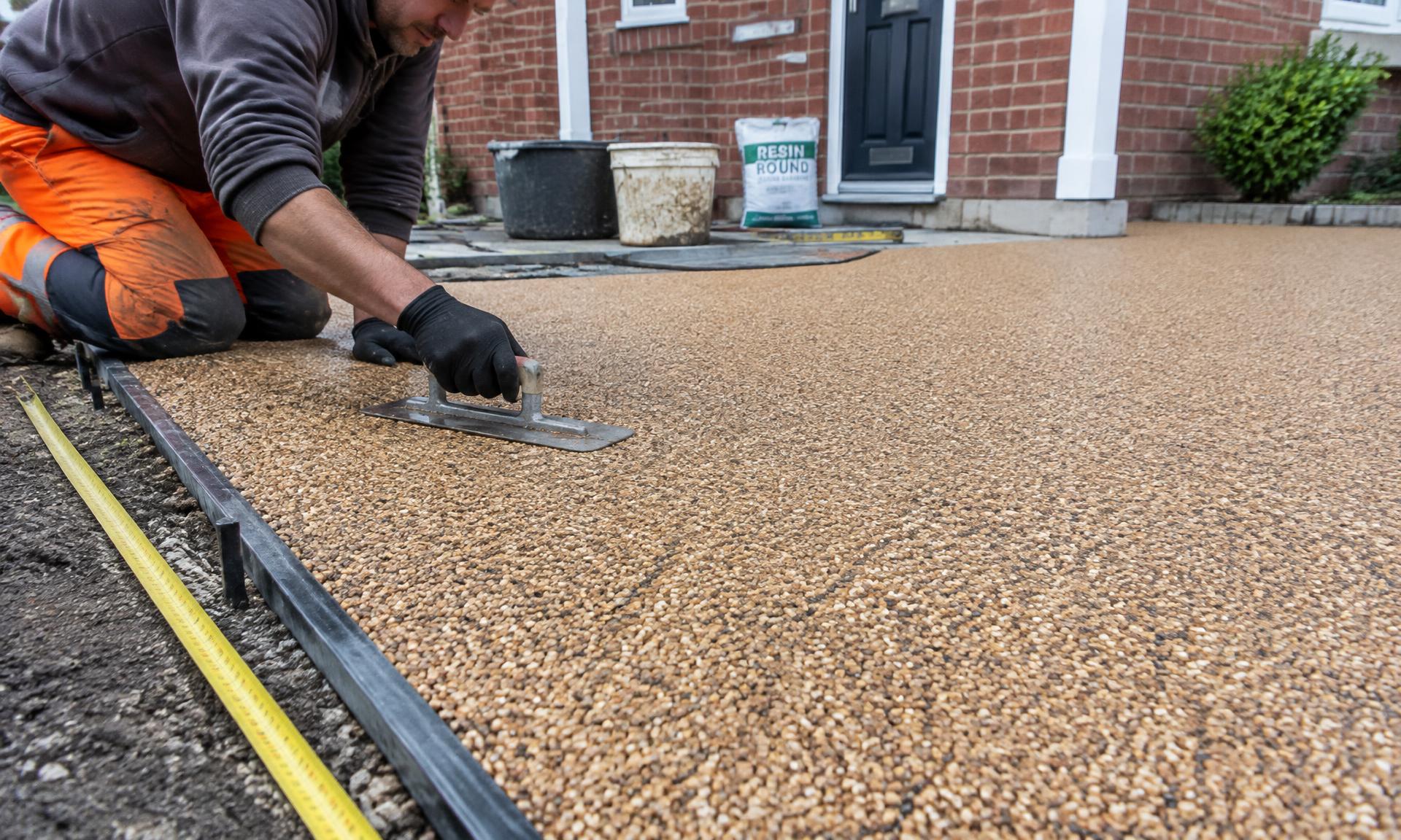 Resin bound driveway being trowelled onto a prepared base