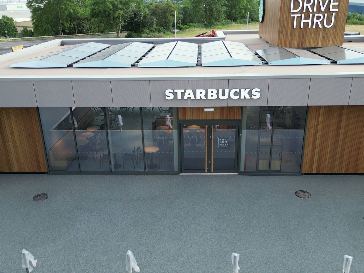 Permeable resin bound surfacing across the drive-thru lane and parking bays